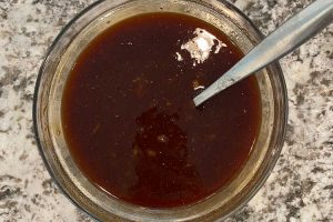 bbq sauce, orange marmalade and soy sauce in mixing bowl