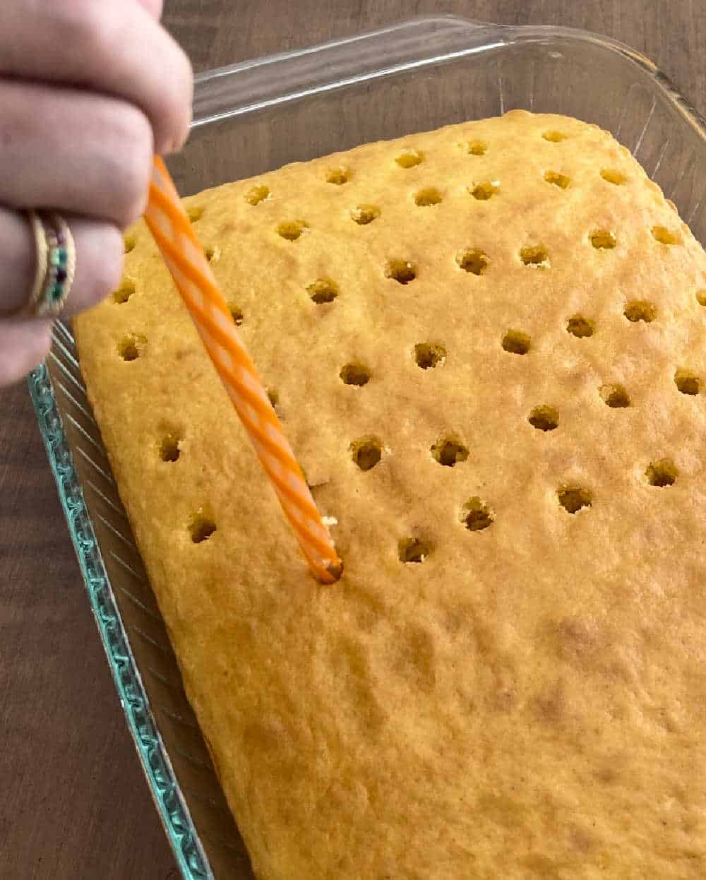 poke holes in cake with large drinking straw.