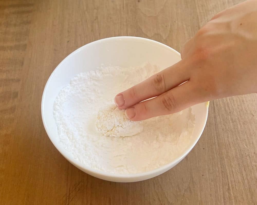 roll cookie dough in powdered sugar.