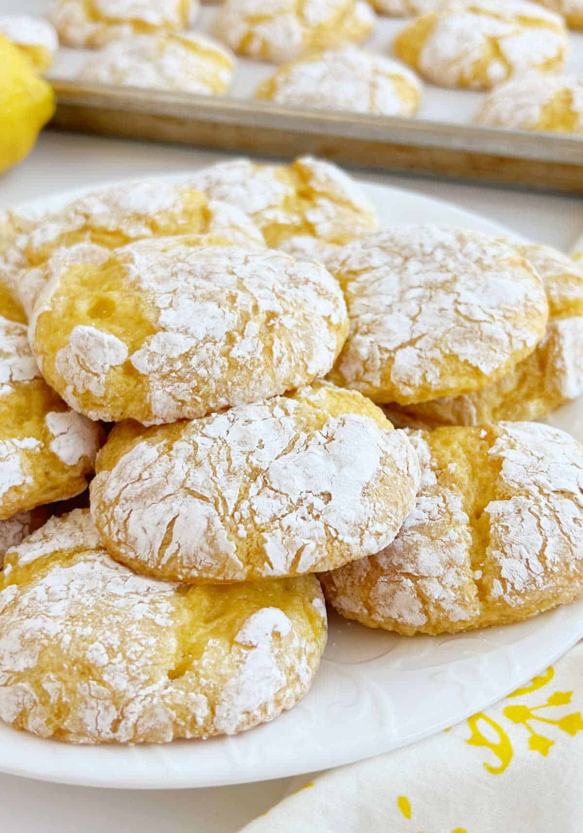 lemon cake mix crinkle cookies on a white plate.