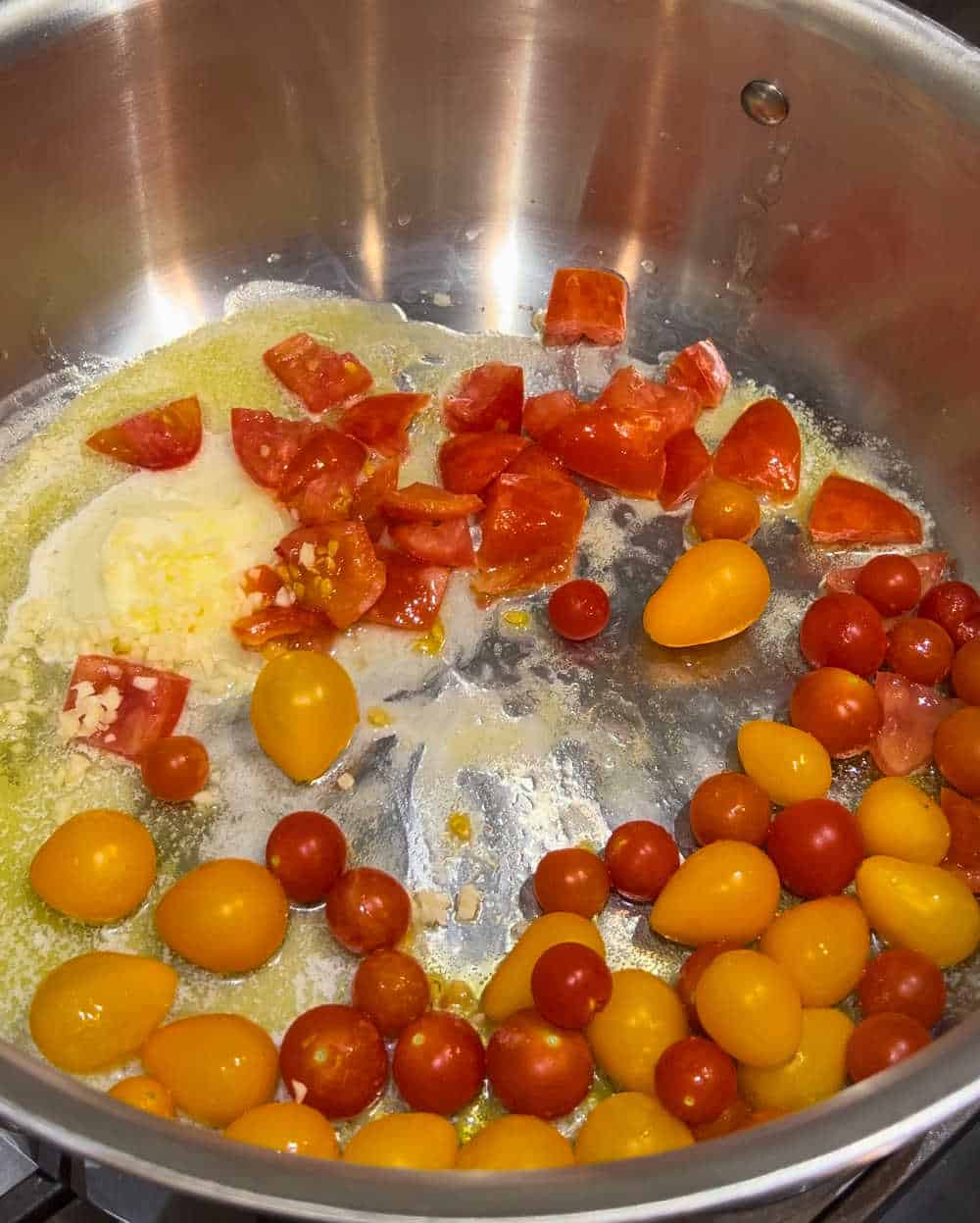 cook tomatoes and garlic in butter and olive oil.
