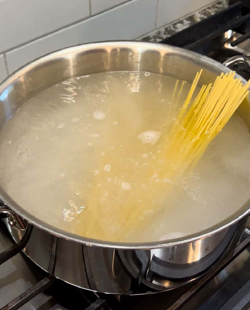 cook spaghetti noodles in boiling water.