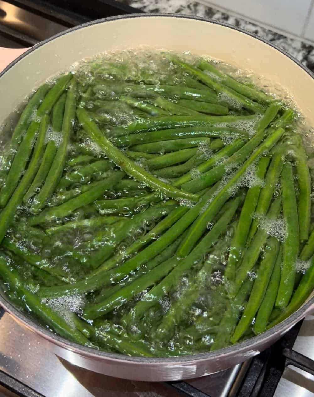 blanche fresh green beans on stove.