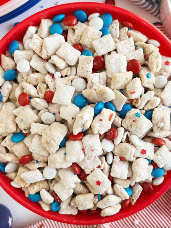 red white and blue puppy chow with patriotic m&m's and chex cereal in a red bowl.
