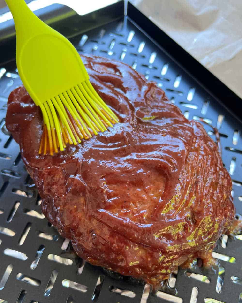 brush bbq sauce on smoked meatloaf