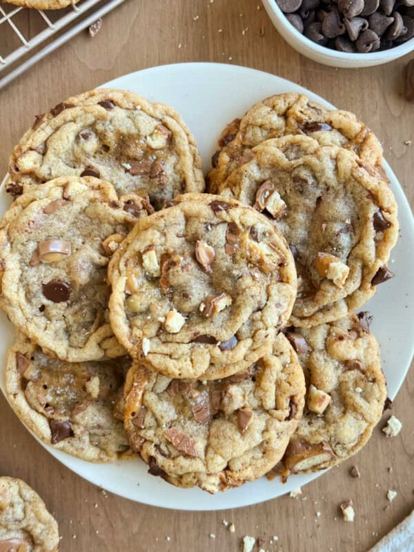 twix cookies with chocolate chips on a plate.