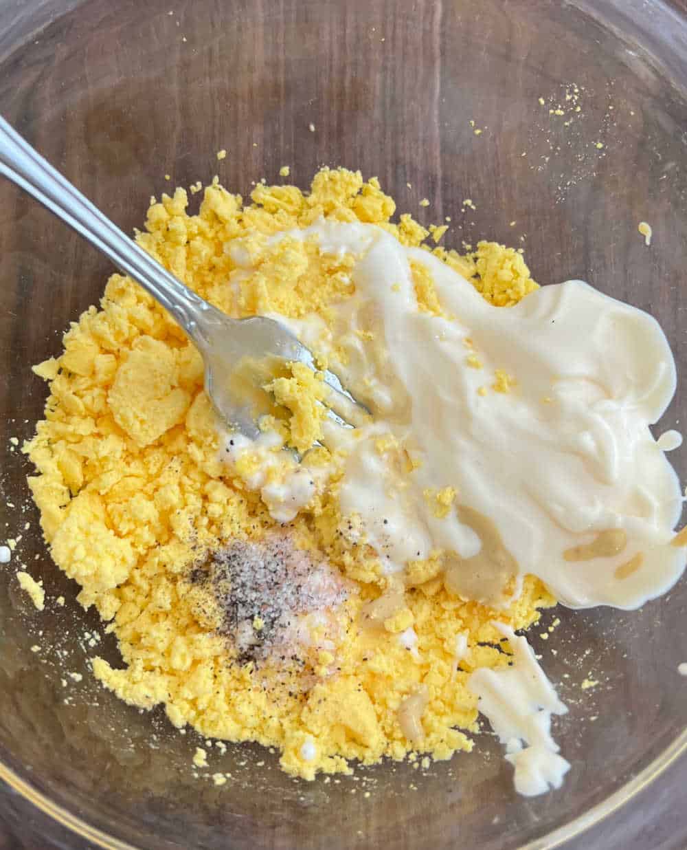 mix yolks with dressing with fork.