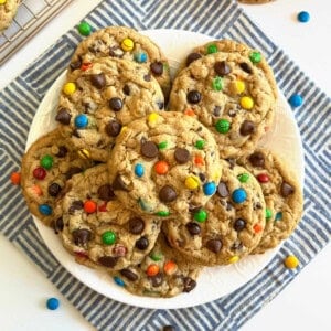 monster cookies stacked on a plate.