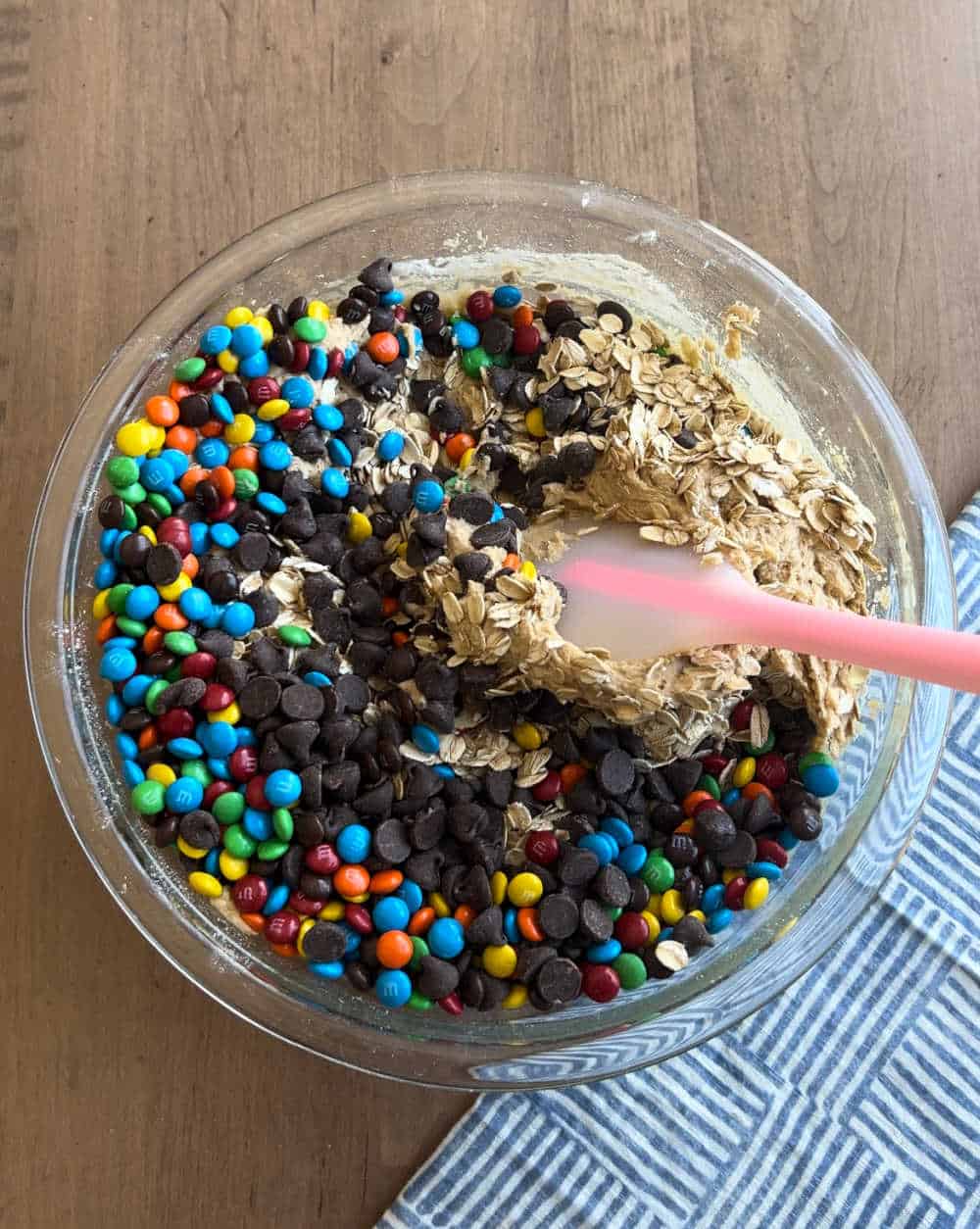 mix in oats, chocolate morsels and m&m candies.