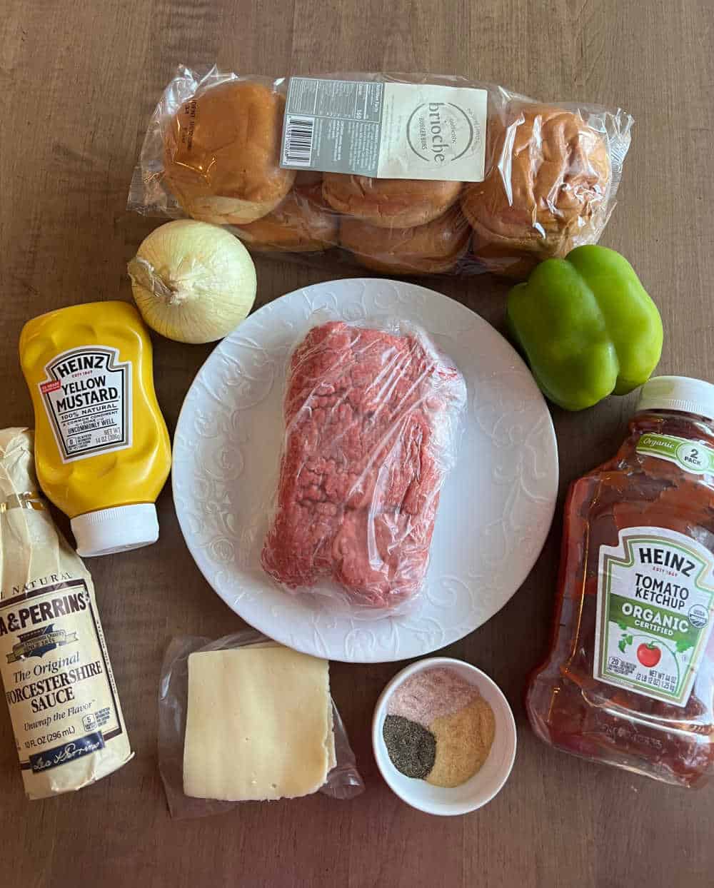 ground beef, hamburger buns, cheese and ingredients for sloppy joe sandwiches.