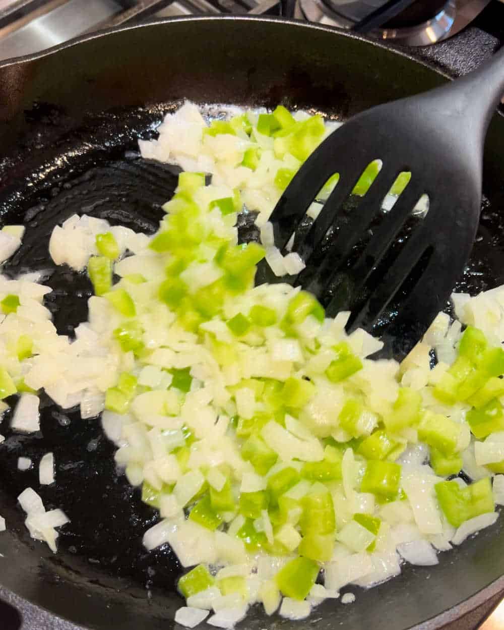 sauté onions and peppers in skillet.