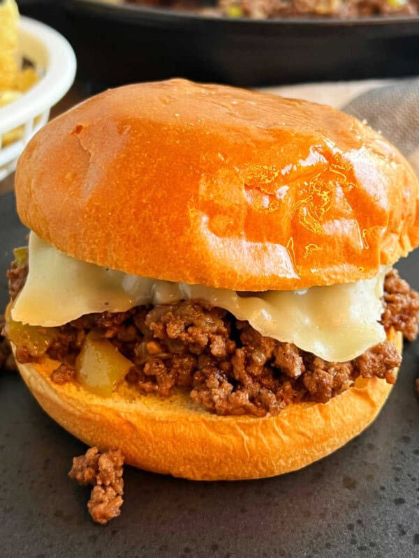 Philly cheesesteak sloppy joes with melted cheese.