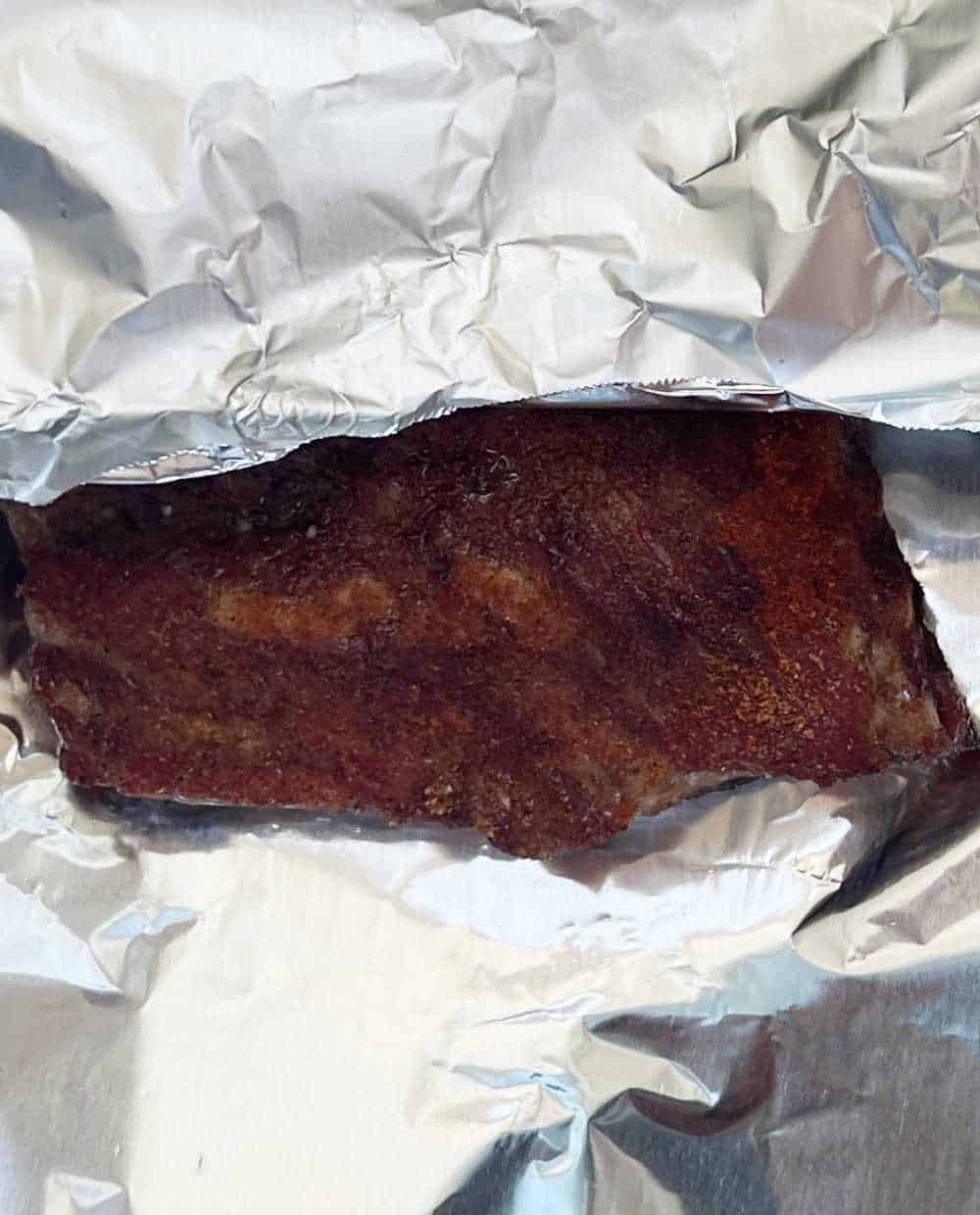 ribs in aluminum foil.