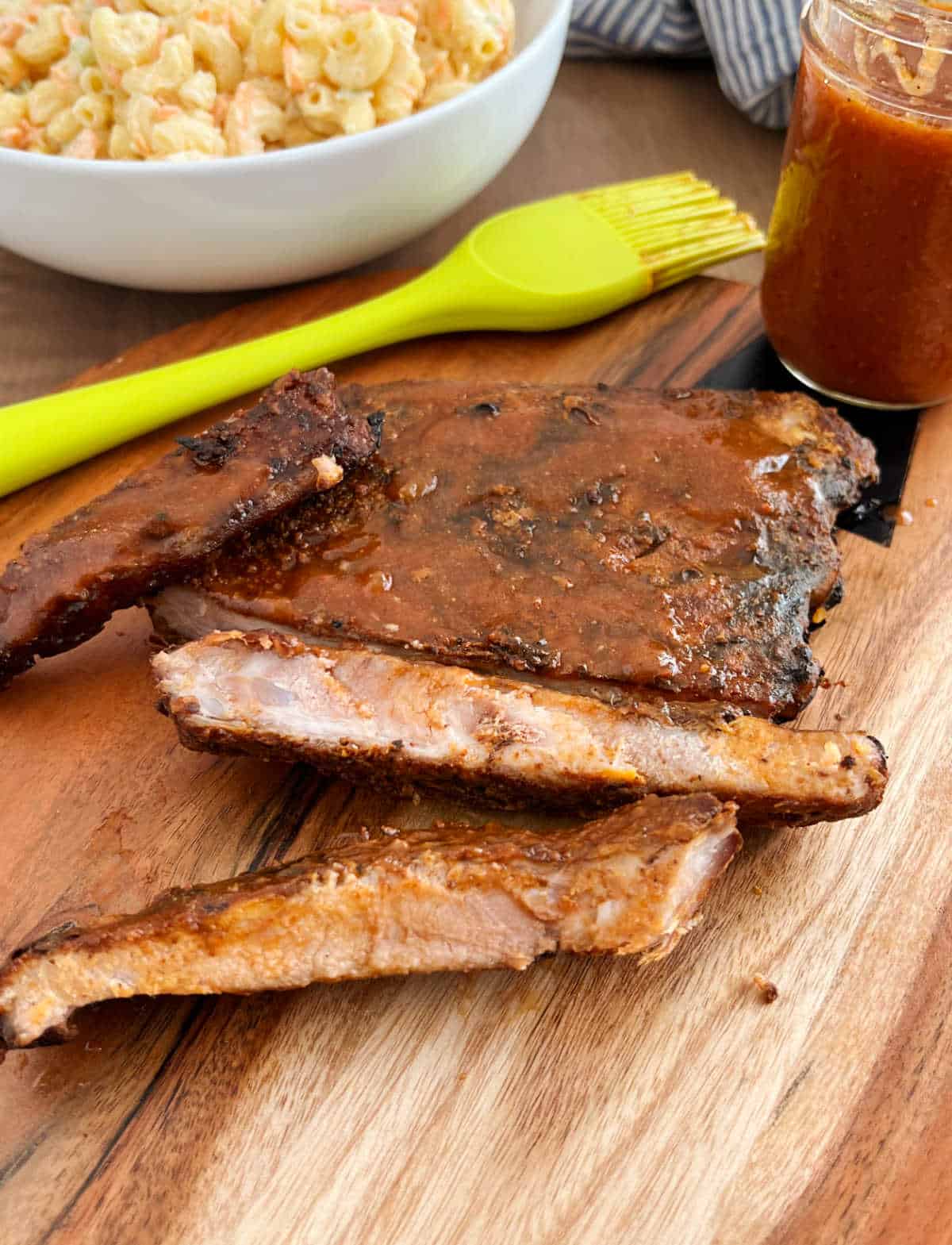 electric smoker ribs with bbq sauce and mac salad.