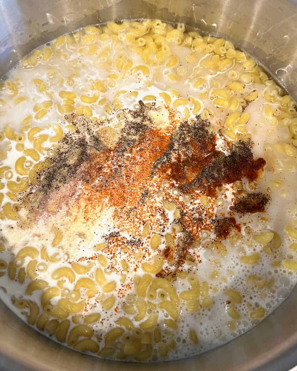 cook macaroni with cream and seasonings.