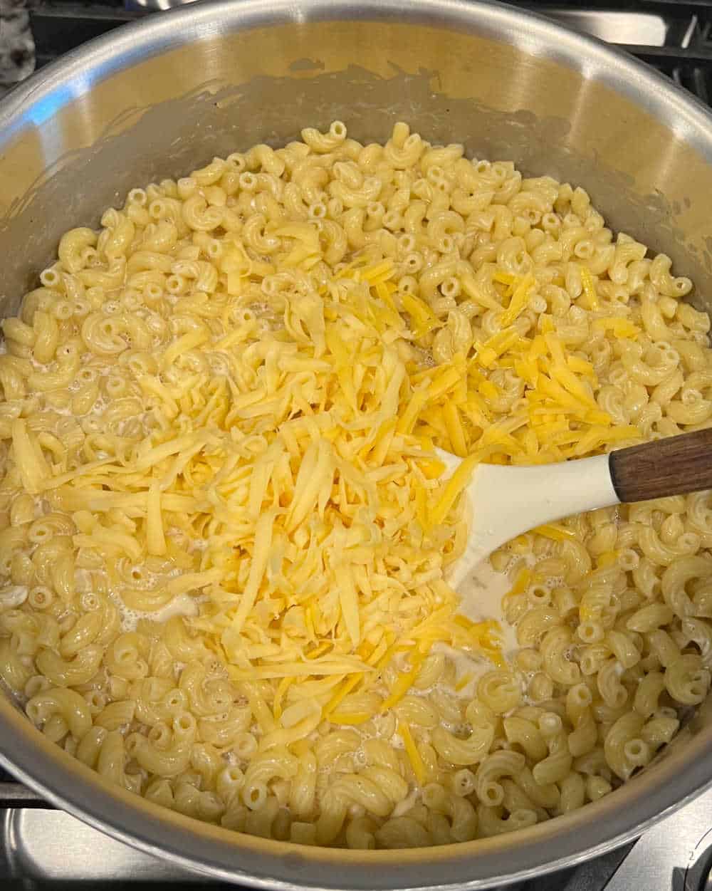 stir cheese into macaroni and sauce.