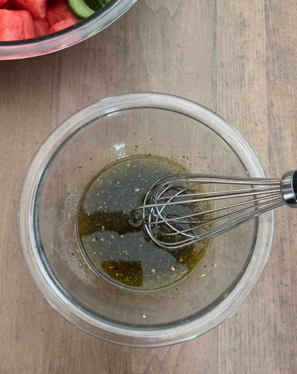 whisk dressing in small bowl.