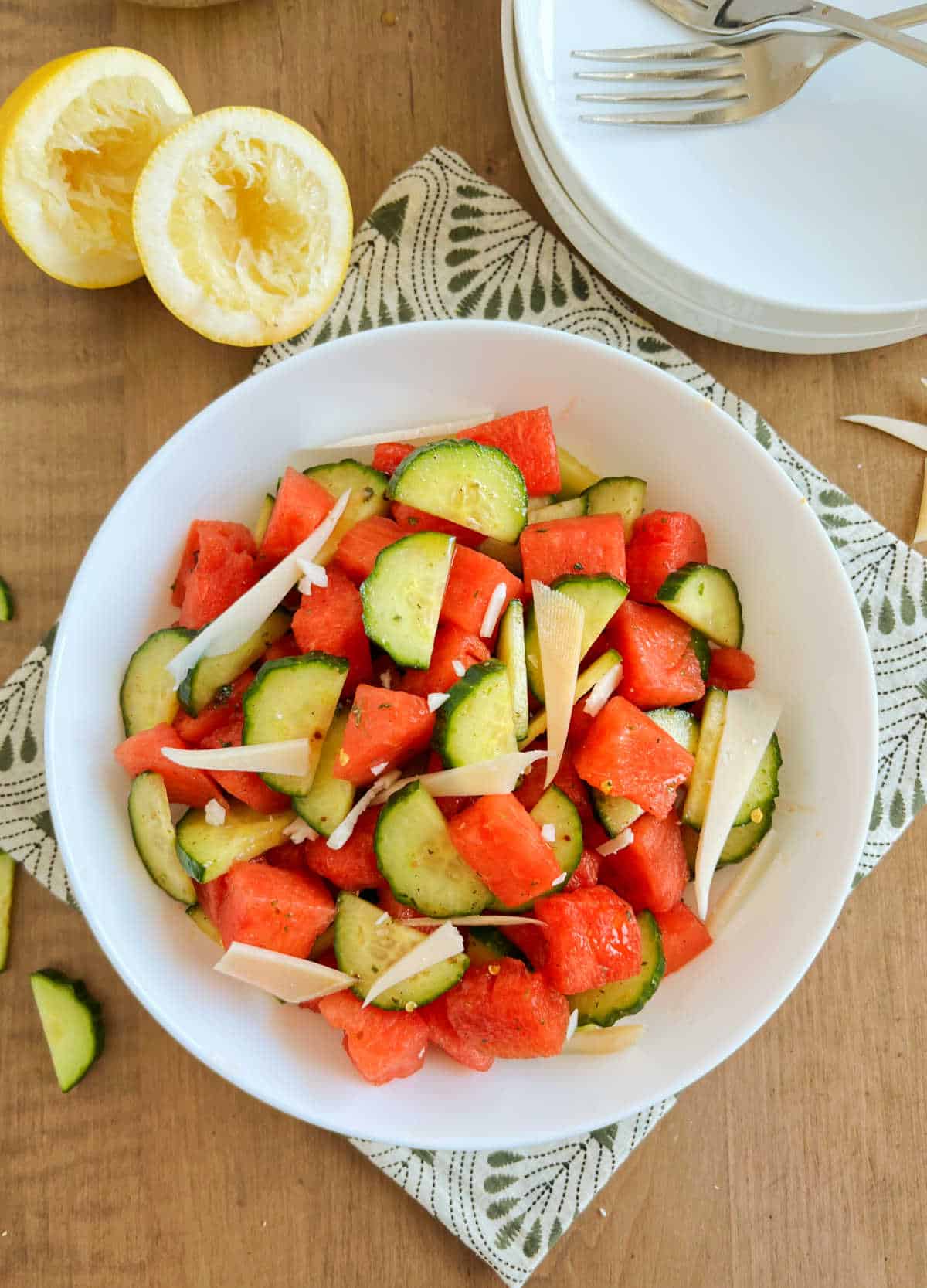 bowl of watermelon salad with cucumbers and goat cheese.