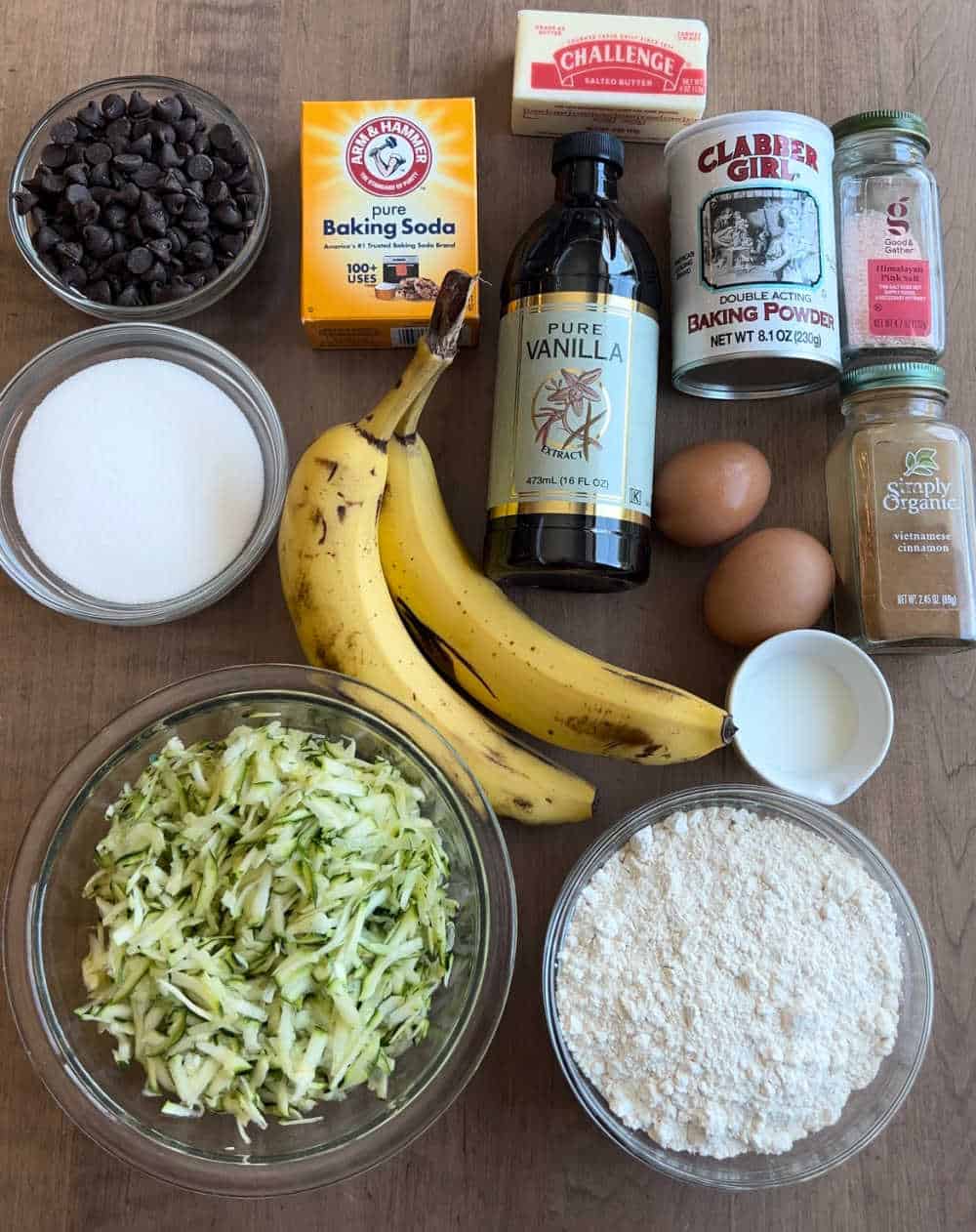 grated zucchini, bananas and ingredients to make muffins.