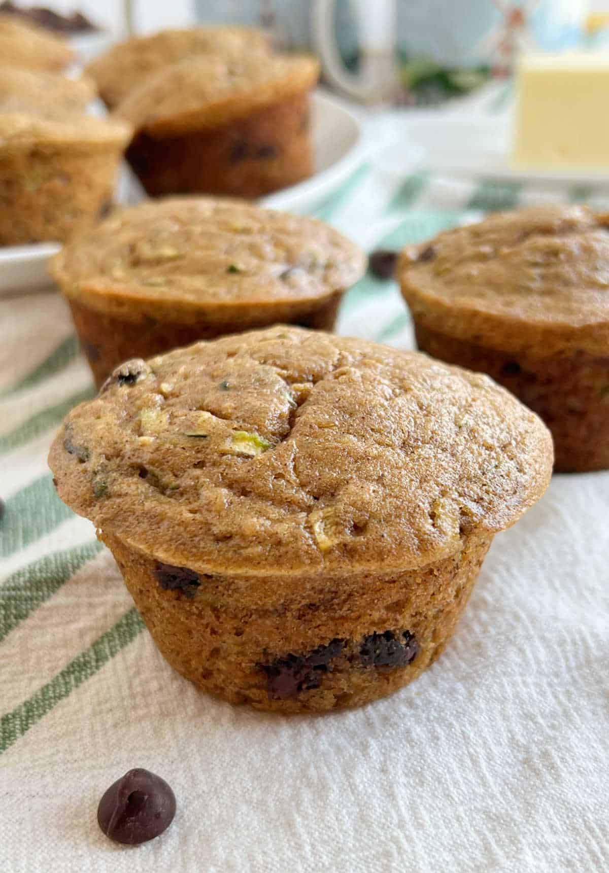 zucchini banana muffins with chocolate chips on the table.