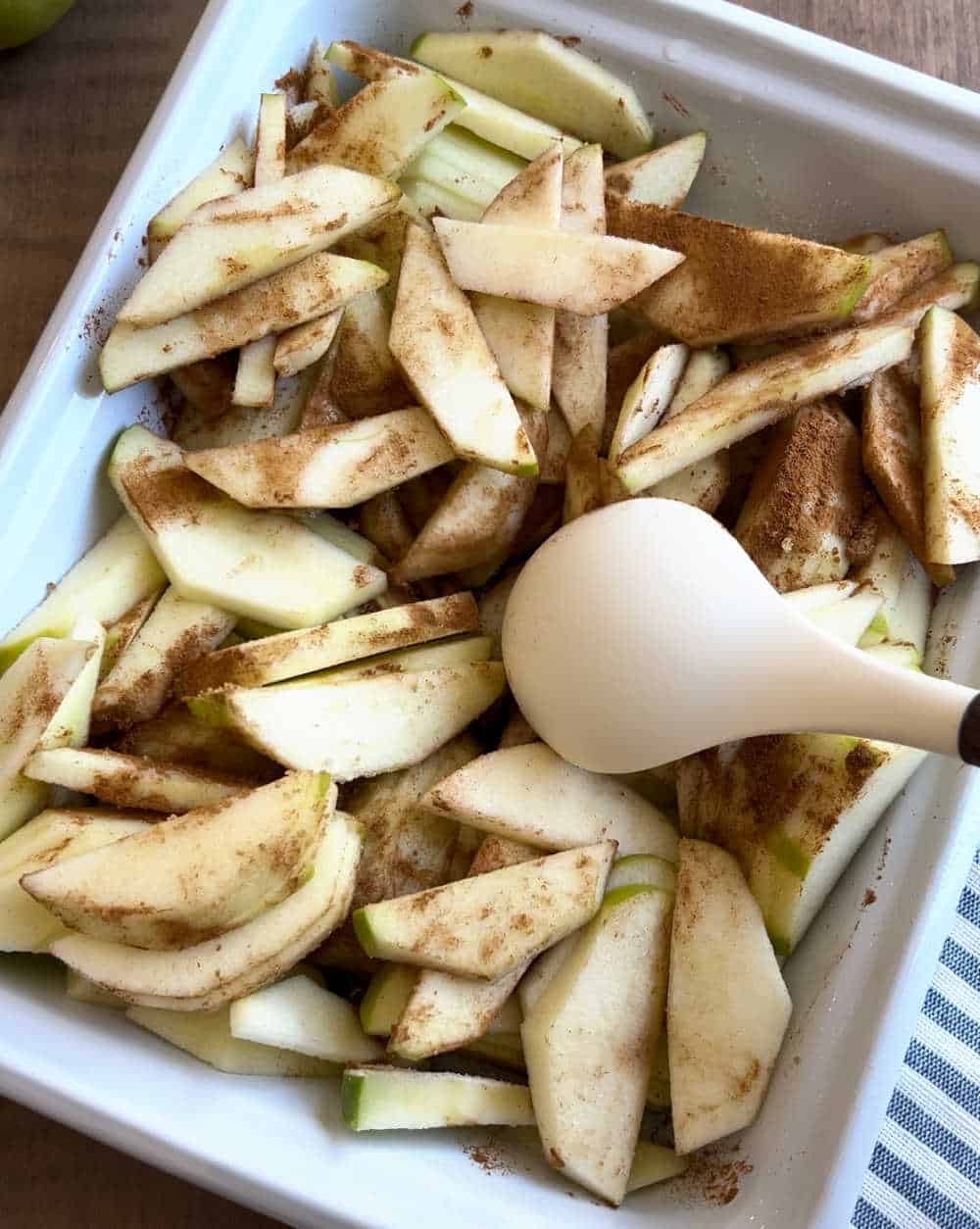 mix apple slices with cinnamon and sugar.