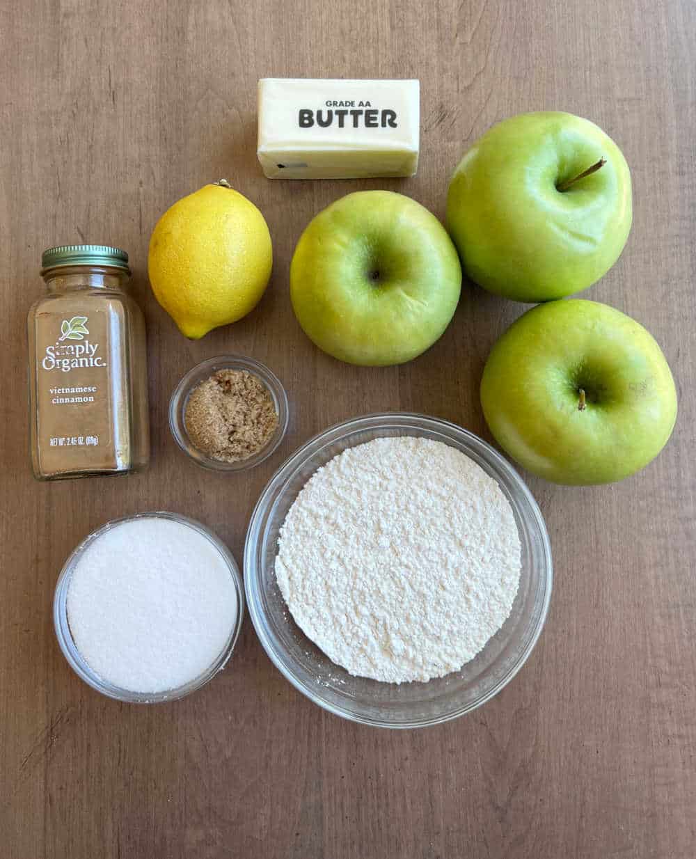 apples, butter, lemon, cinnamon, brown sugar, white sugar, flour.