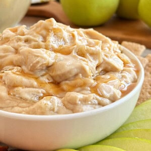 apple pie dip with caramel sauce in serving bowl.