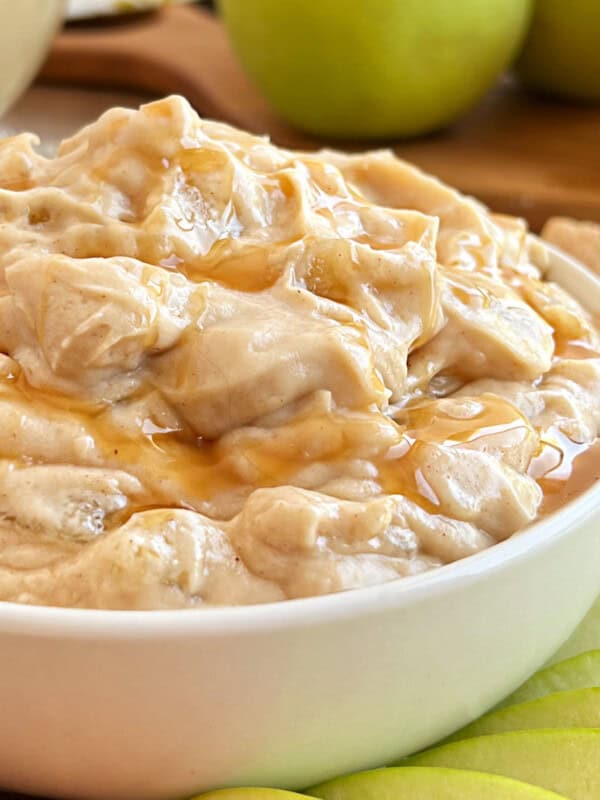 apple pie dip with caramel sauce in serving bowl.