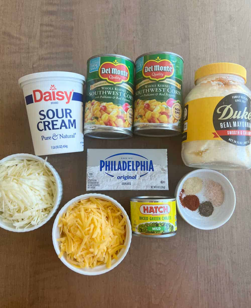 canned southwest corn, mayo, sour cream, cream cheese, shredded cheese, chiles, spices.