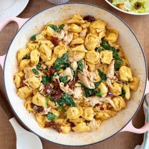 creamy chicken tortellini with spinach and sun dried tomatoes in cream sauce.