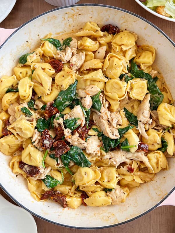 creamy chicken tortellini with spinach and sun dried tomatoes in cream sauce.