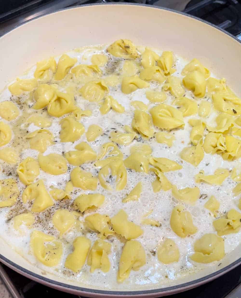 cook tortellini in cream sauce.