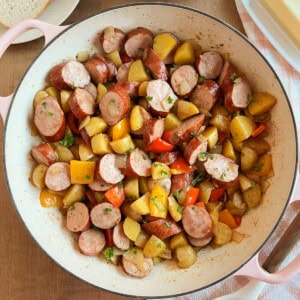 fried kielbasa with potatoes and peppers.