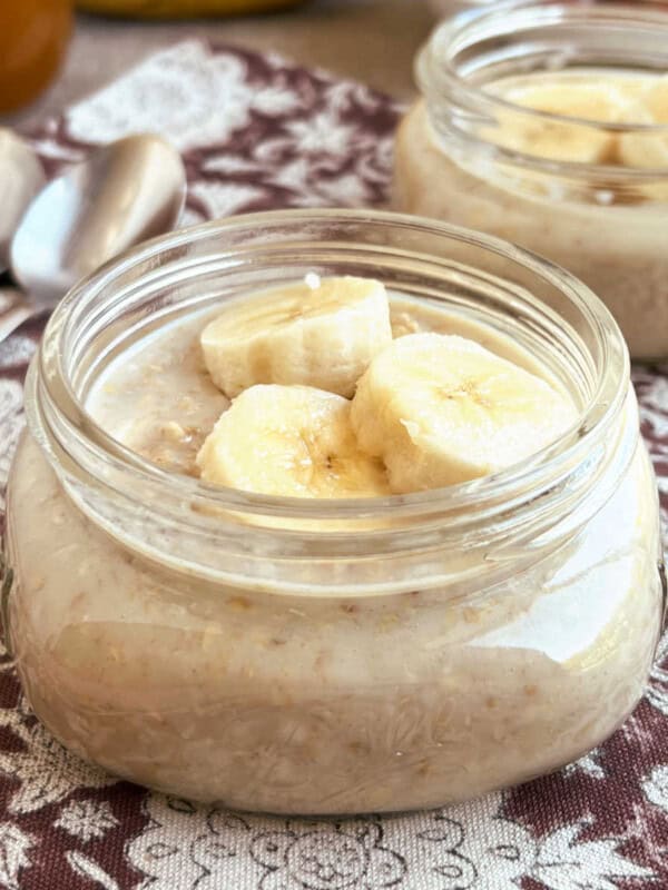 maple brown sugar overnight oats with banana slices in mason jar.