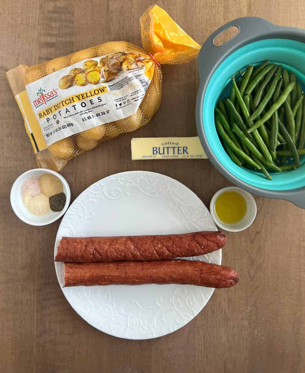 smoked sausage, baby dutch potatoes, fresh green beans, butter, olive oil and spices.