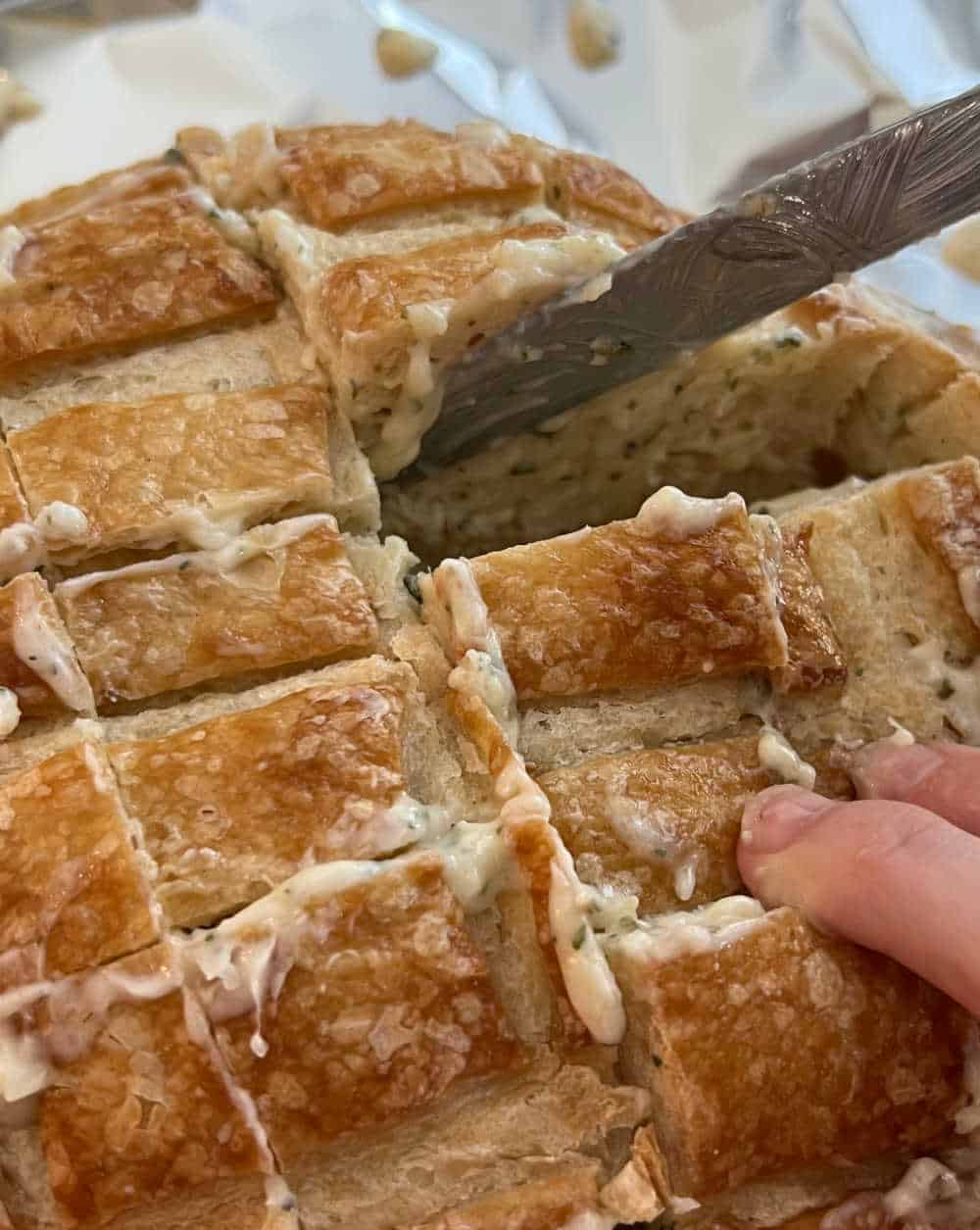 spread garlic butter over bread loaf.