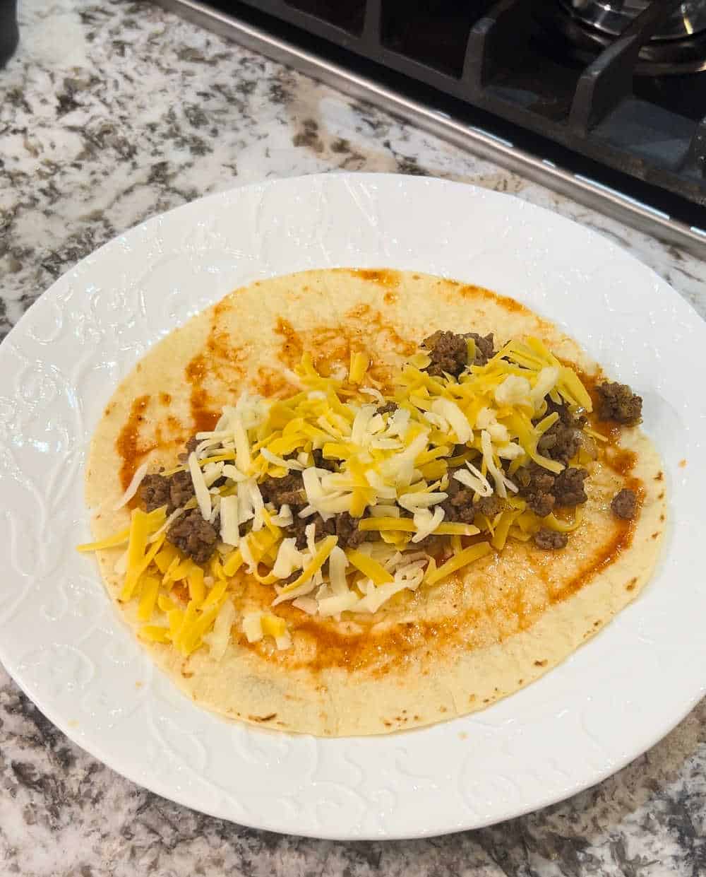 fill tortillas with meat and cheese.