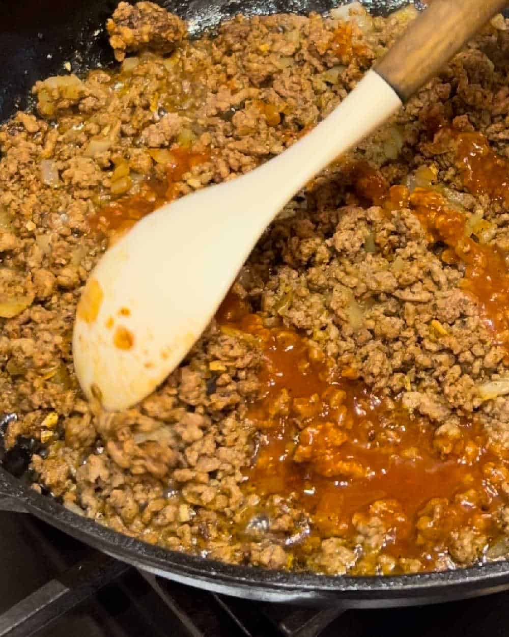 stir ground beef mixture in skillet.