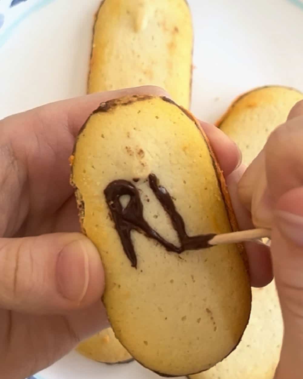 Write RIP on Milano cookies with melted chocolate.