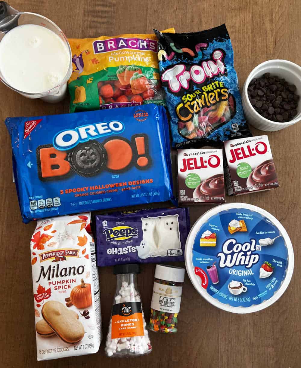 Halloween oreos, candy, pudding, cool whip, milano cookies, milk.