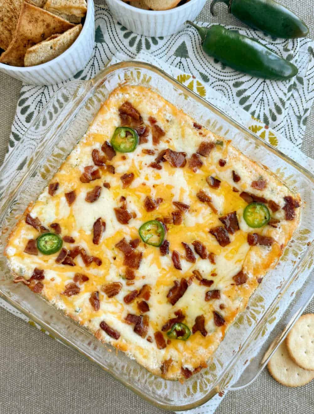 warm jalapeno popper dip with bacon in casserole dish.