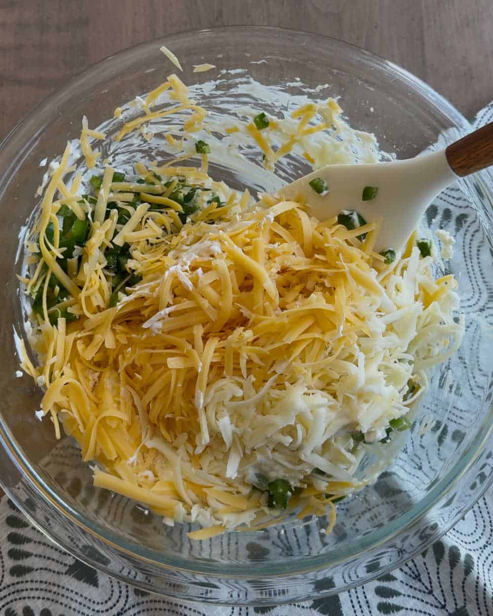 mix shredded cheese into dip.