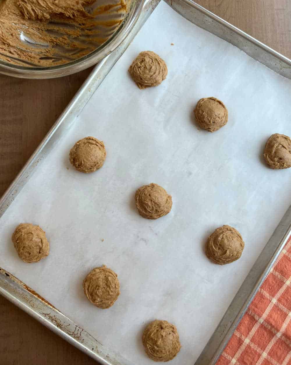 dough balls on cookie sheet.