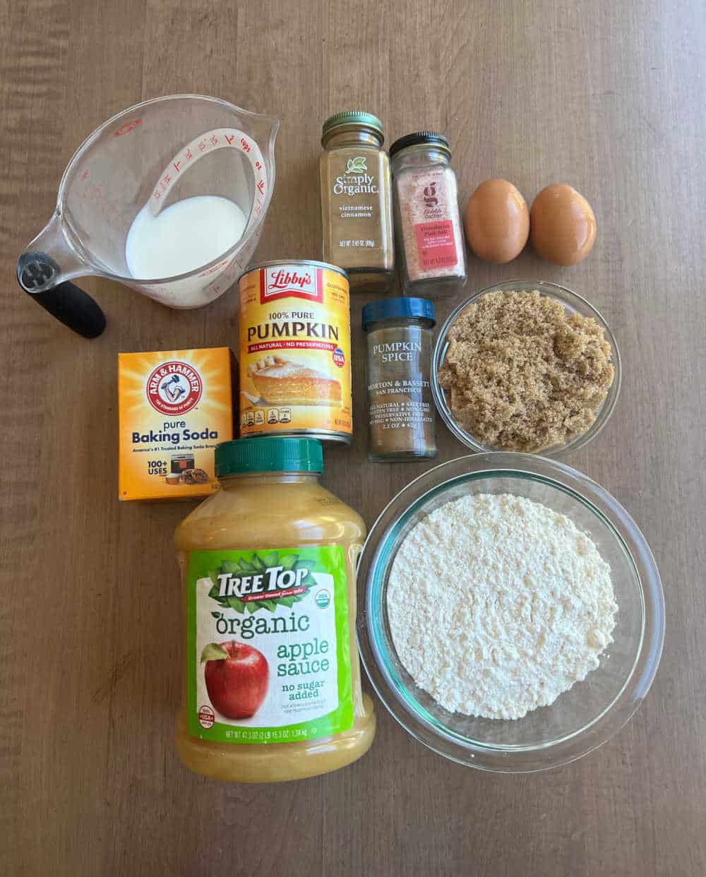 canned pumpkin, applesauce, flour, baking soda, brown sugar, milk, eggs and spices.