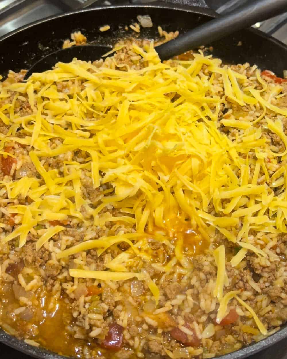 stir cheese into ground beef mixture.