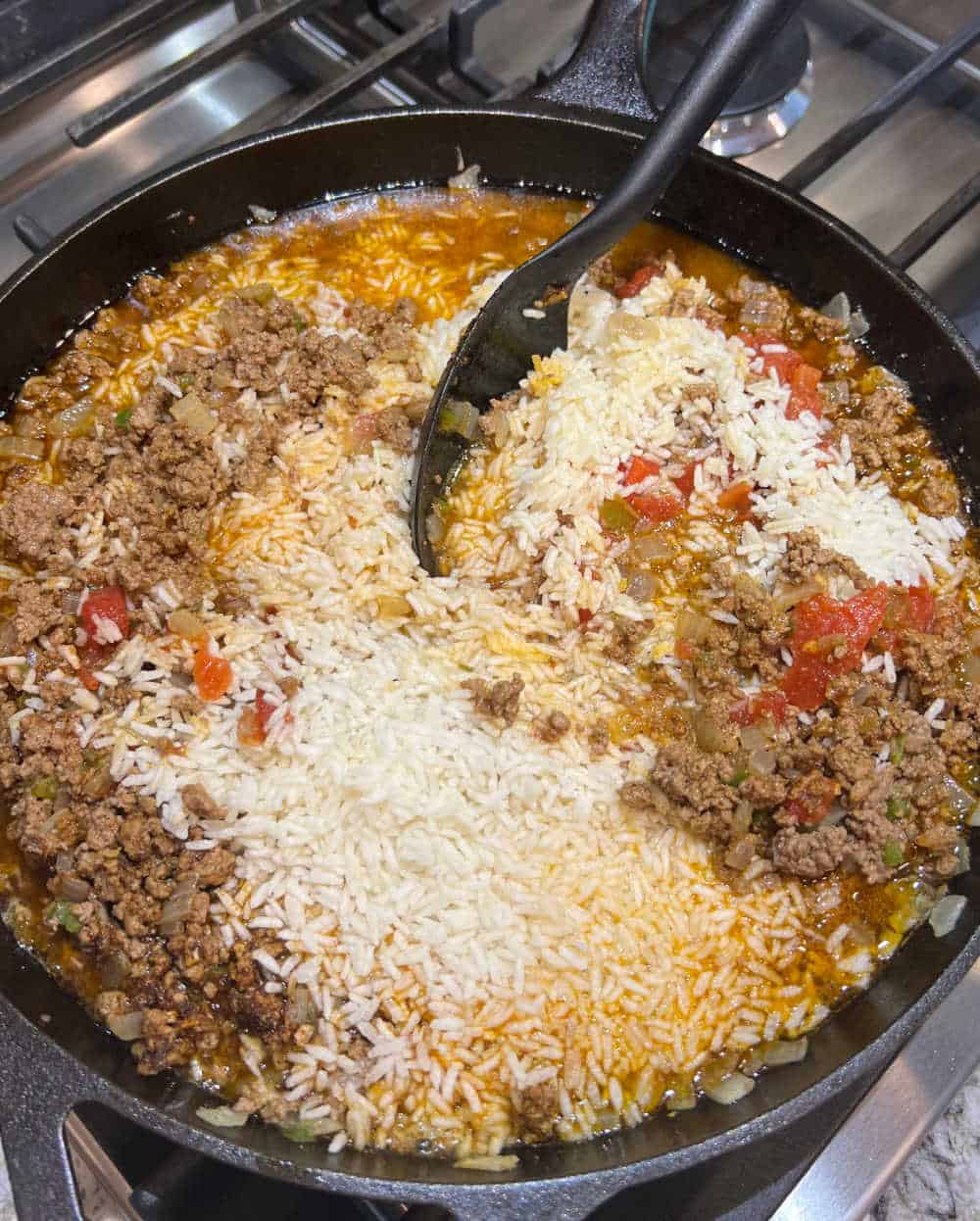 stir rice and beef in skillet.