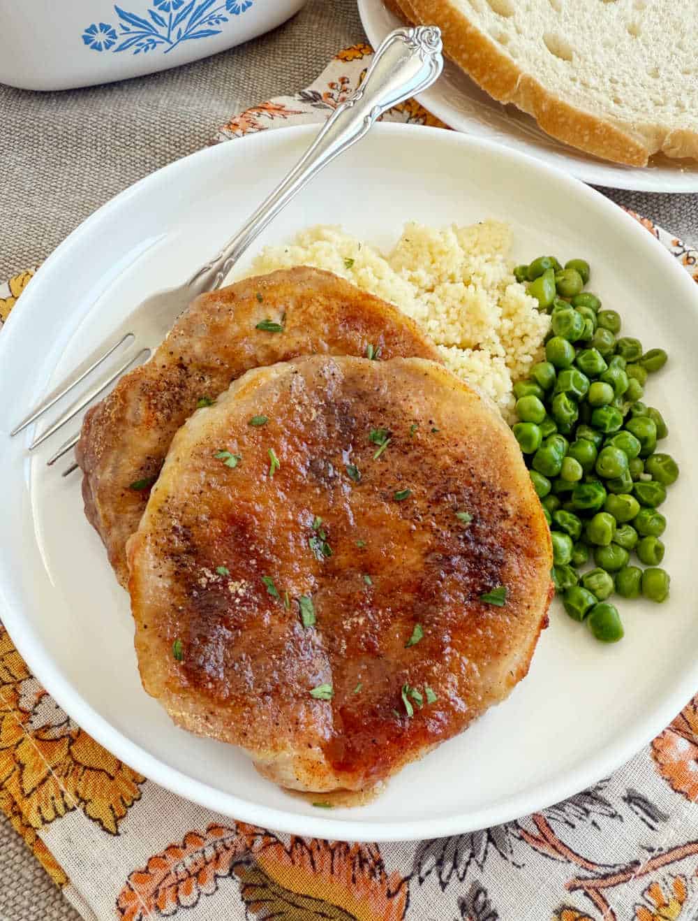 baked pork chops with brown sugar and paprika on plate.