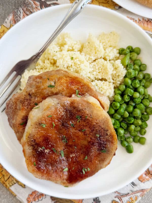 baked brown sugar pork chops on plate.