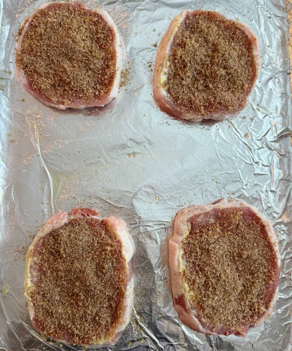 seasoned chops on baking sheet.