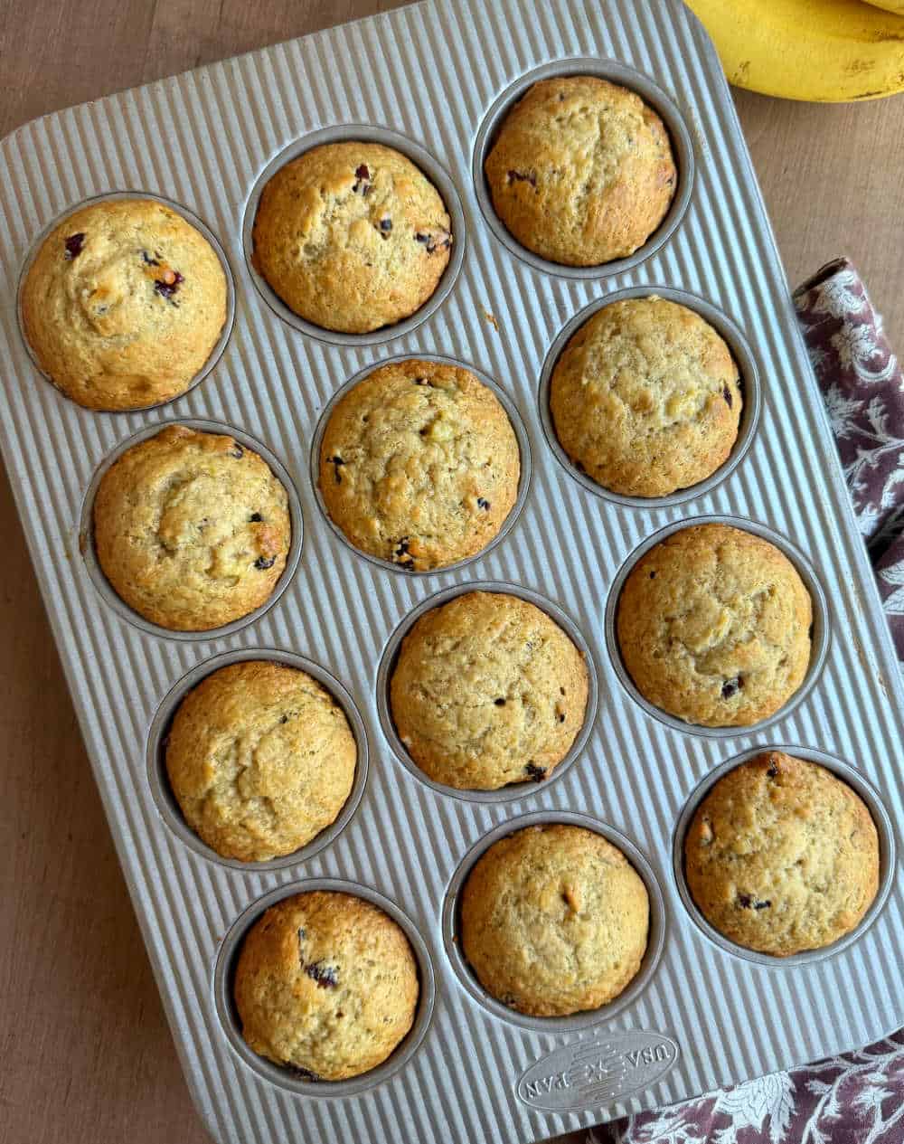 cranberry banana muffins in muffin tin.